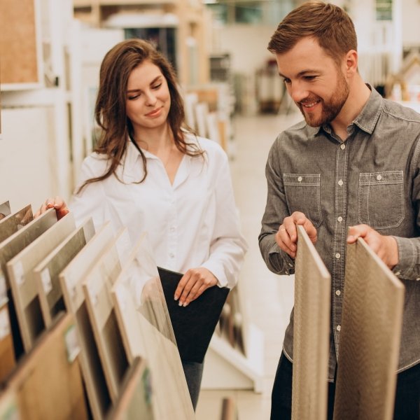 Browsing a hardwood flooring sample display in a local showroom